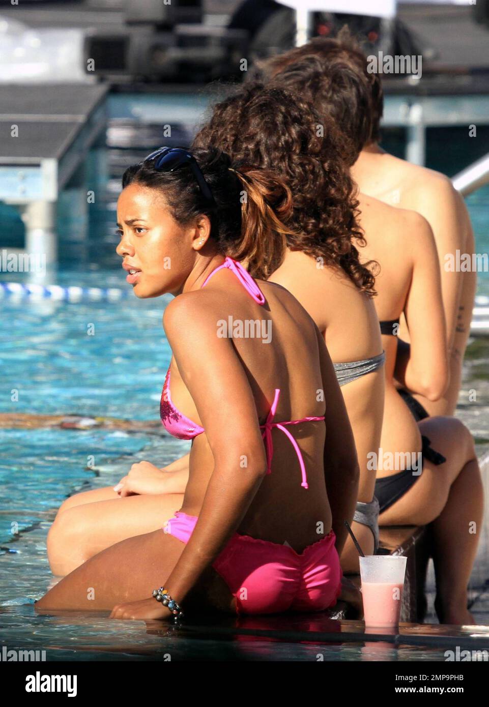 Daughter of RUN DMCs Rev Run, Angela Simmons wears a pink bikini while enjoying the South Florida sun poolside and on the beach on New Years