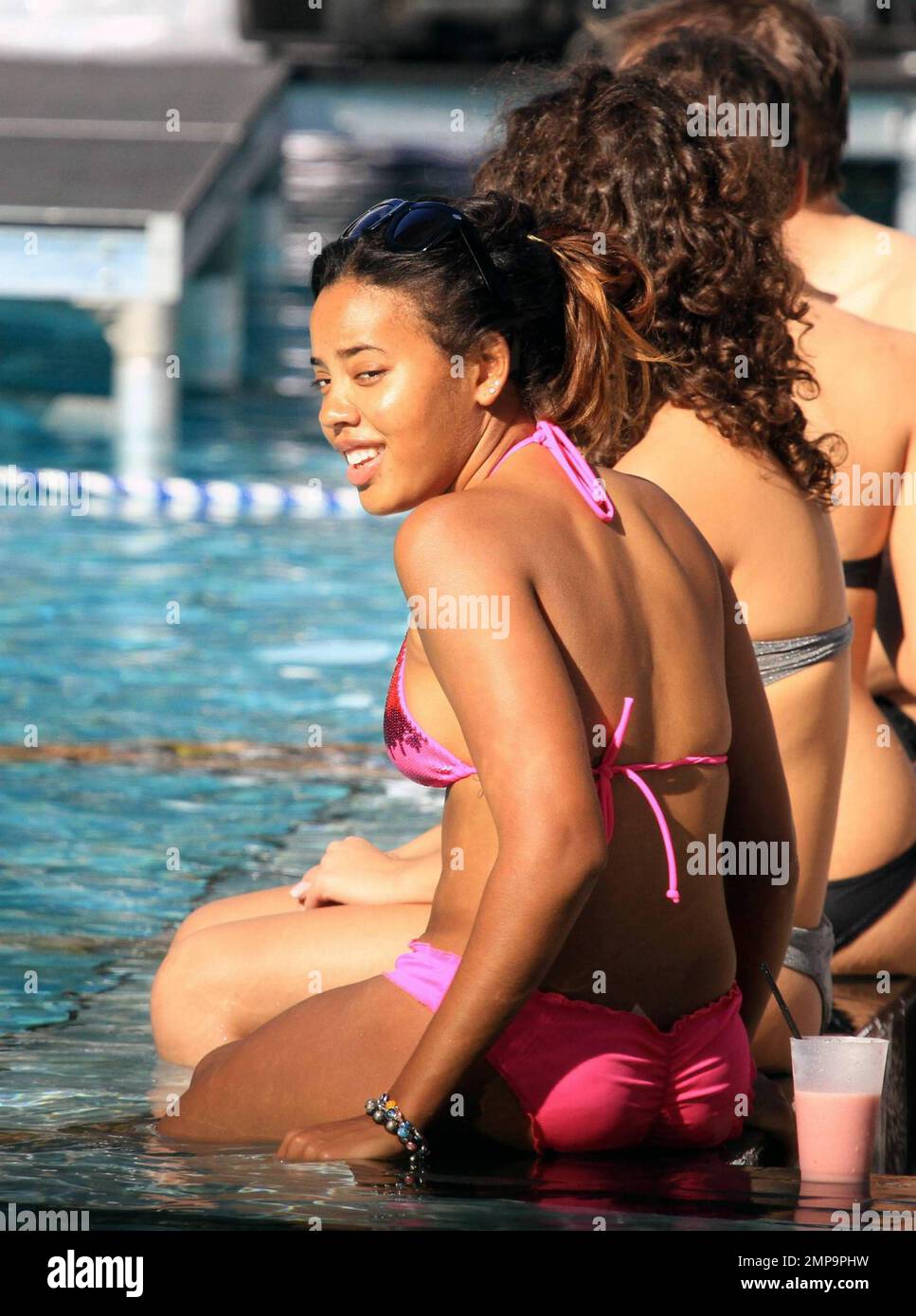 Daughter of RUN DMC's Rev Run, Angela Simmons wears a pink bikini while