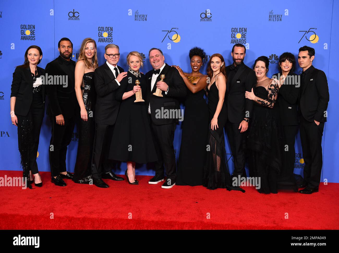 The cast and crew of "The Handmaid's Tale" pose in the press room with