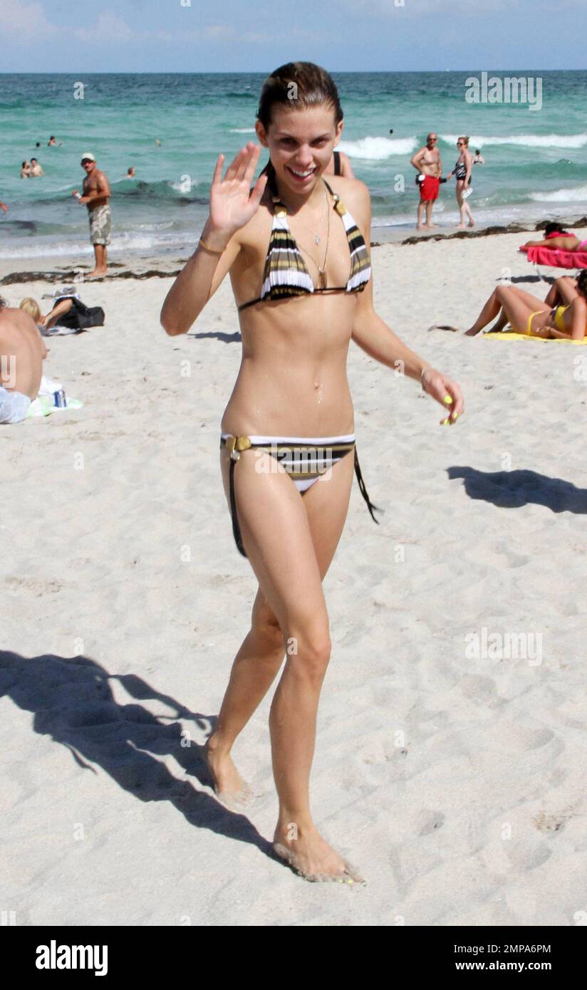 AnnaLynne McCord shows off her slender frame in a striped bikini. The 90201  actress took a dip in the warm Atlantic ocean after sunbathing in the 90  degrees Miami heat with sister