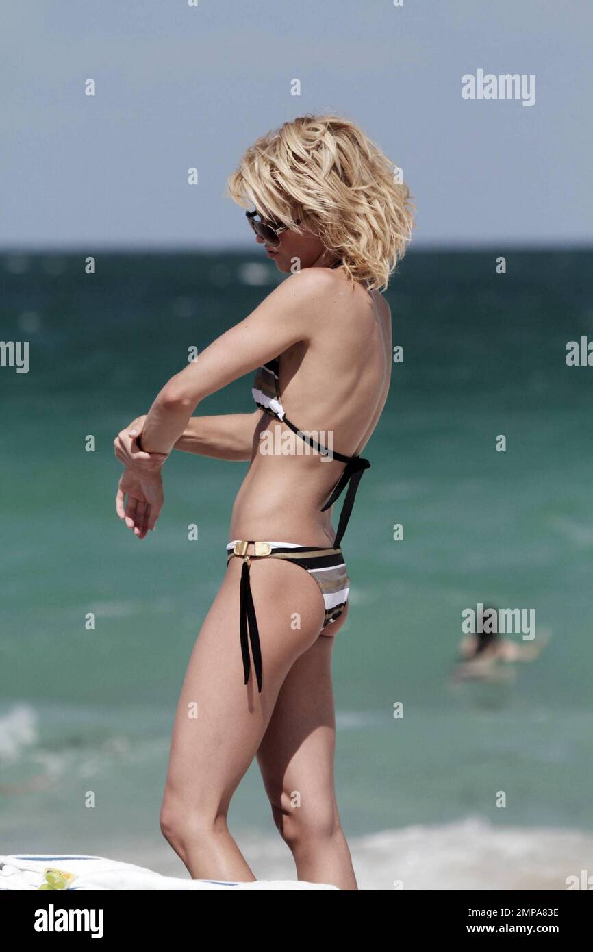 AnnaLynne McCord and her sister Angel swap their bikinis during an ocean  dip on Miami Beach. The cheeky sisters confused photographers when  AnnaLynne entered the ocean in an animal print bikini but