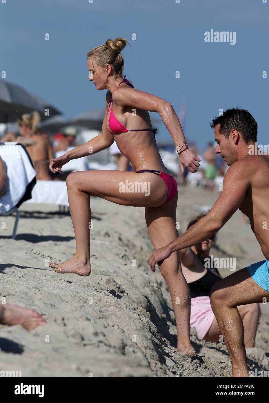 Russian supermodel Anne 'V' Vyalitsyna was seen showing off her amazing  toned body in a hot pink bikini in Miami Beach a day after Thanksgiving.  The 26 year old Victoria's Secret model