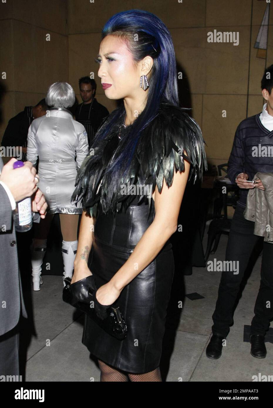 Jeannie Mai wears fabulous makeup and a feather detailed dress as she  attends the 2nd Annual Tasty Awards, celebrating the best in Food and  Fashion programs on TV, in Film and on, image size:930x1390