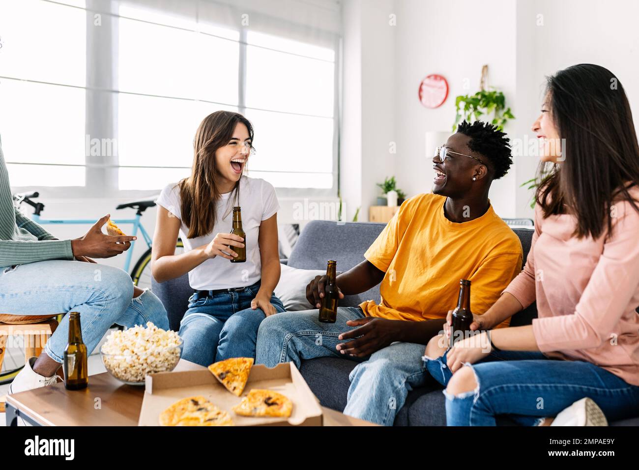 Cheerful group of young multiracial friends having fun together at home Stock Photo