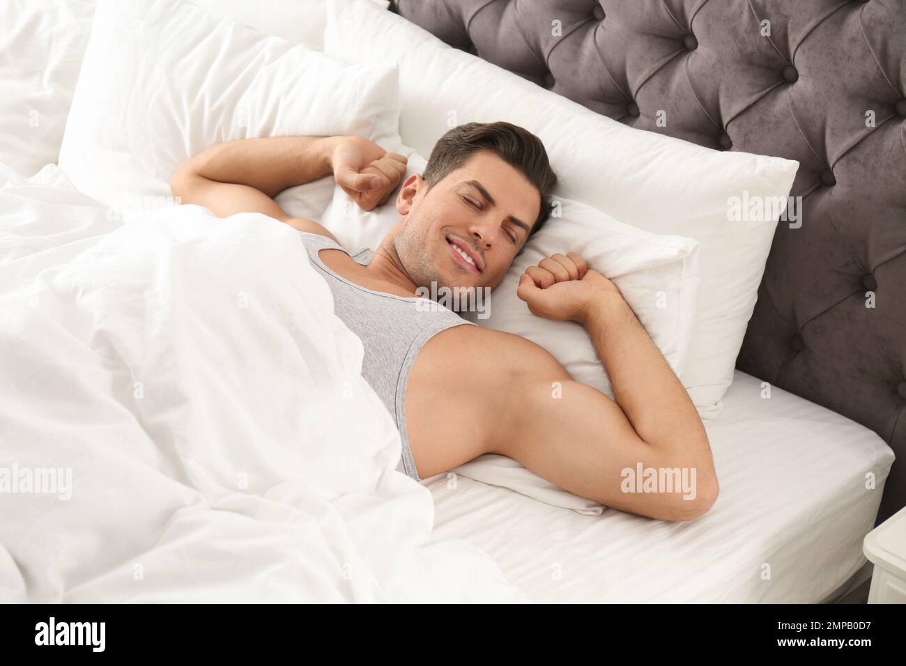 Man awakening on bed hi-res stock photography and images - Alamy