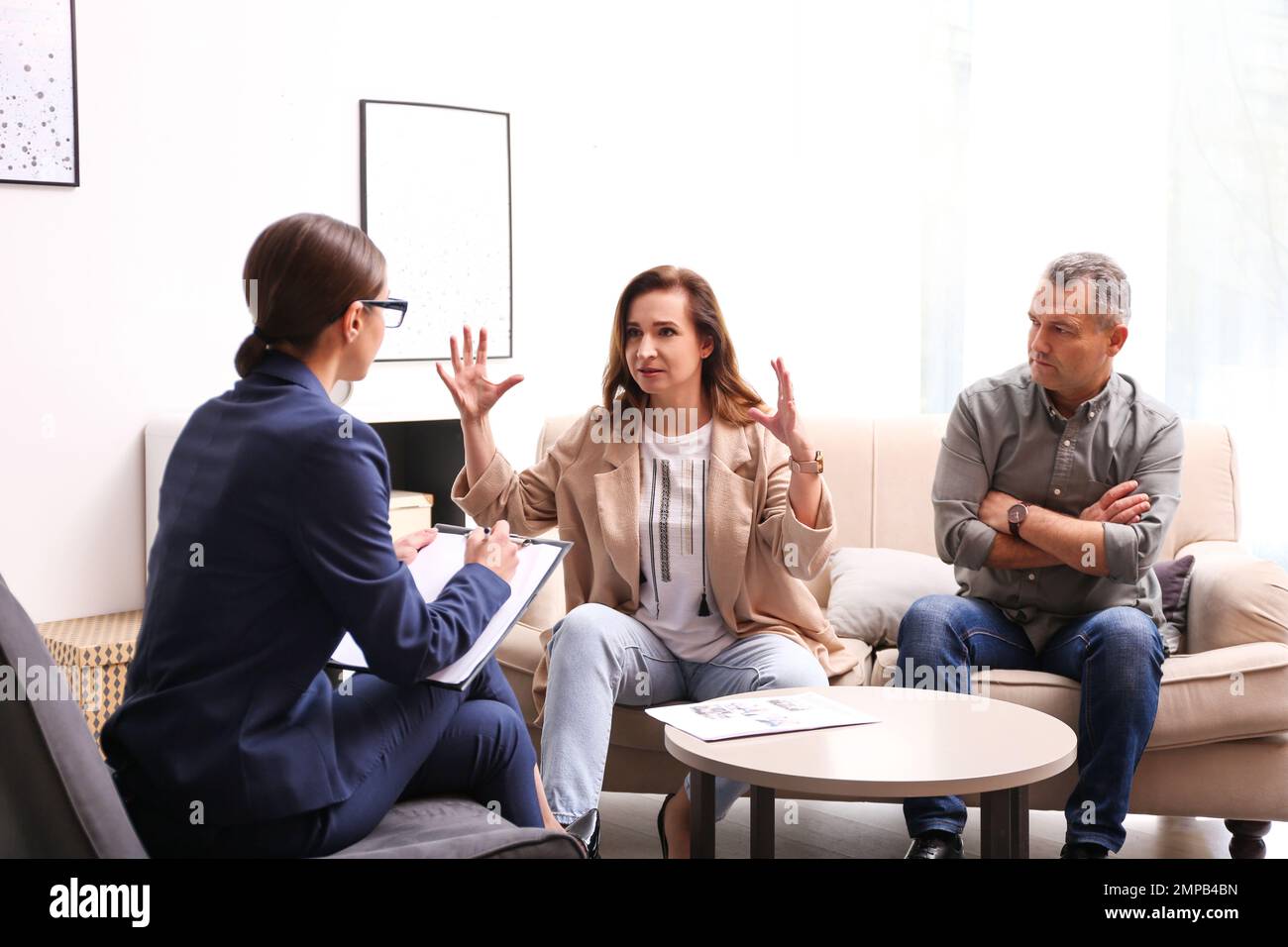 Psychotherapist working with couple in office. Family counselling Stock Photo