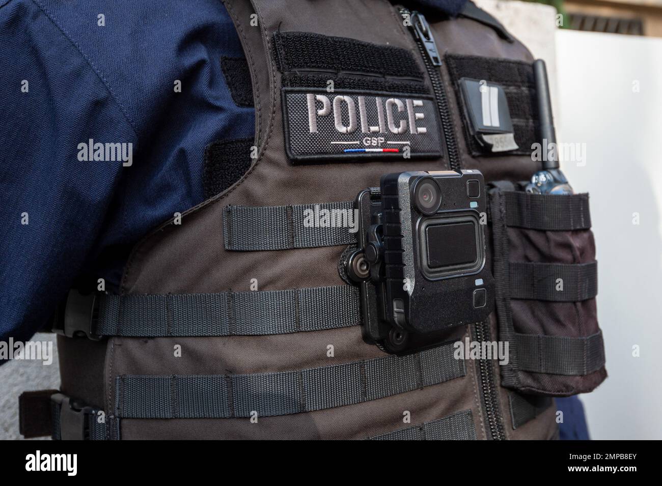 Marseille, France. 27th Jan, 2023. Close-up of a police officer on patrol  with a bullet-proof vest on which a camera is attached to record the  control and intervention operations. French MP Lionel