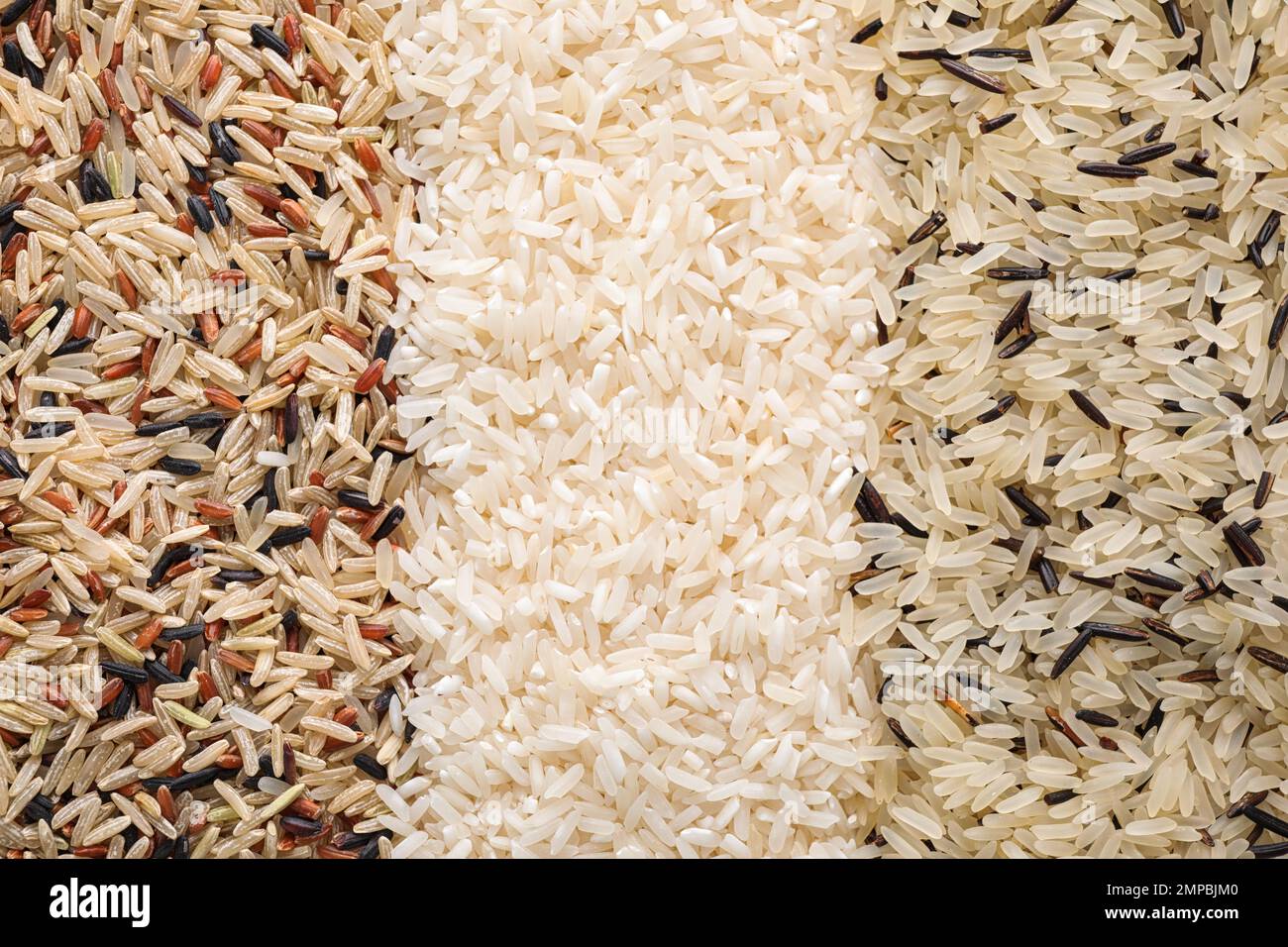 Different types of rice as background, top view Stock Photo - Alamy