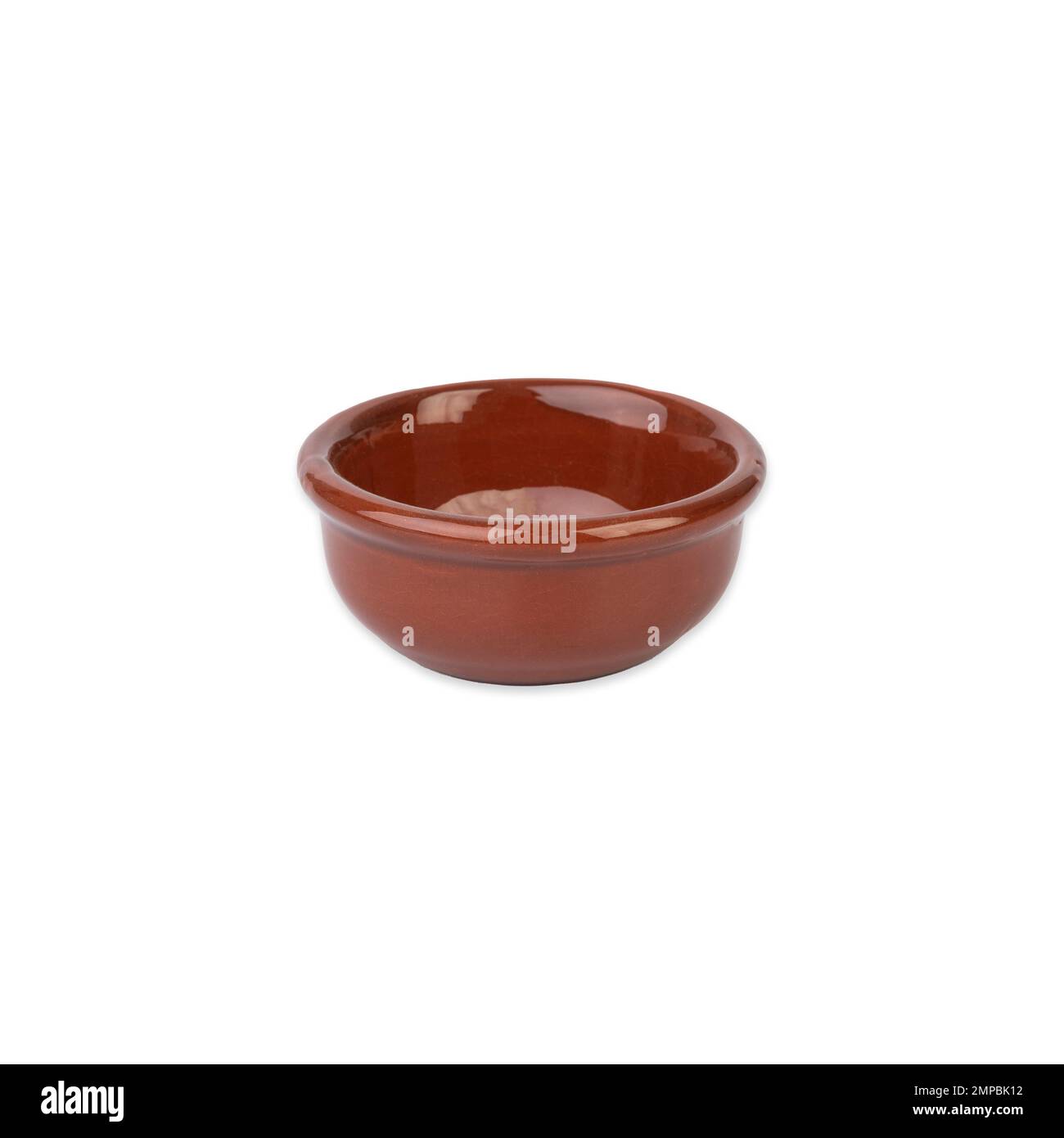 Rustic brown ceramic bowl isolated over white background. Stock Photo