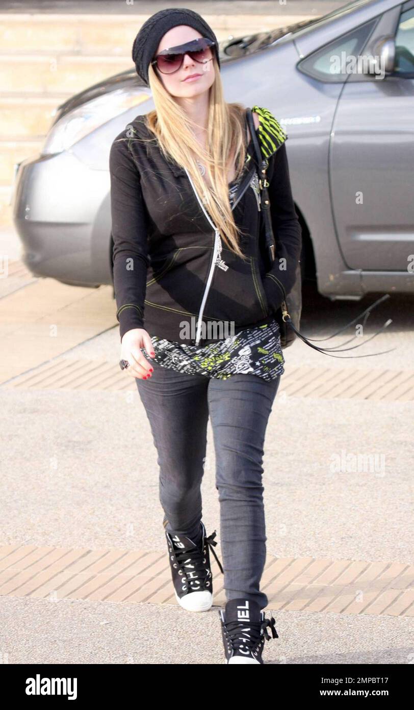 Avril Lavigne rocks a pair of Chanel high-top sneakers as she gets