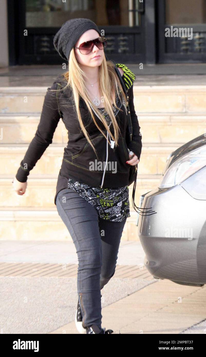 Avril Lavigne rocks a pair of Chanel high top sneakers as she gets in a day of shopping at Barneys New York in Beverly Hills CA. 12 13 09 Stock Photo Alamy