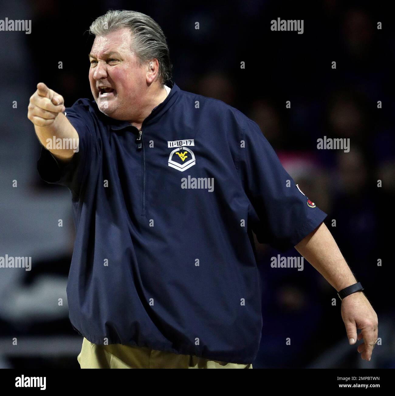 West Virginia head coach Bob Huggins directs his team during the second