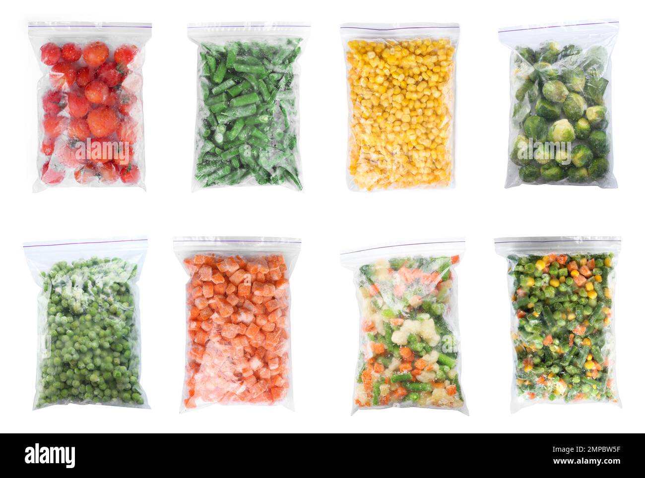 Set of different frozen vegetables in plastic bags on white background