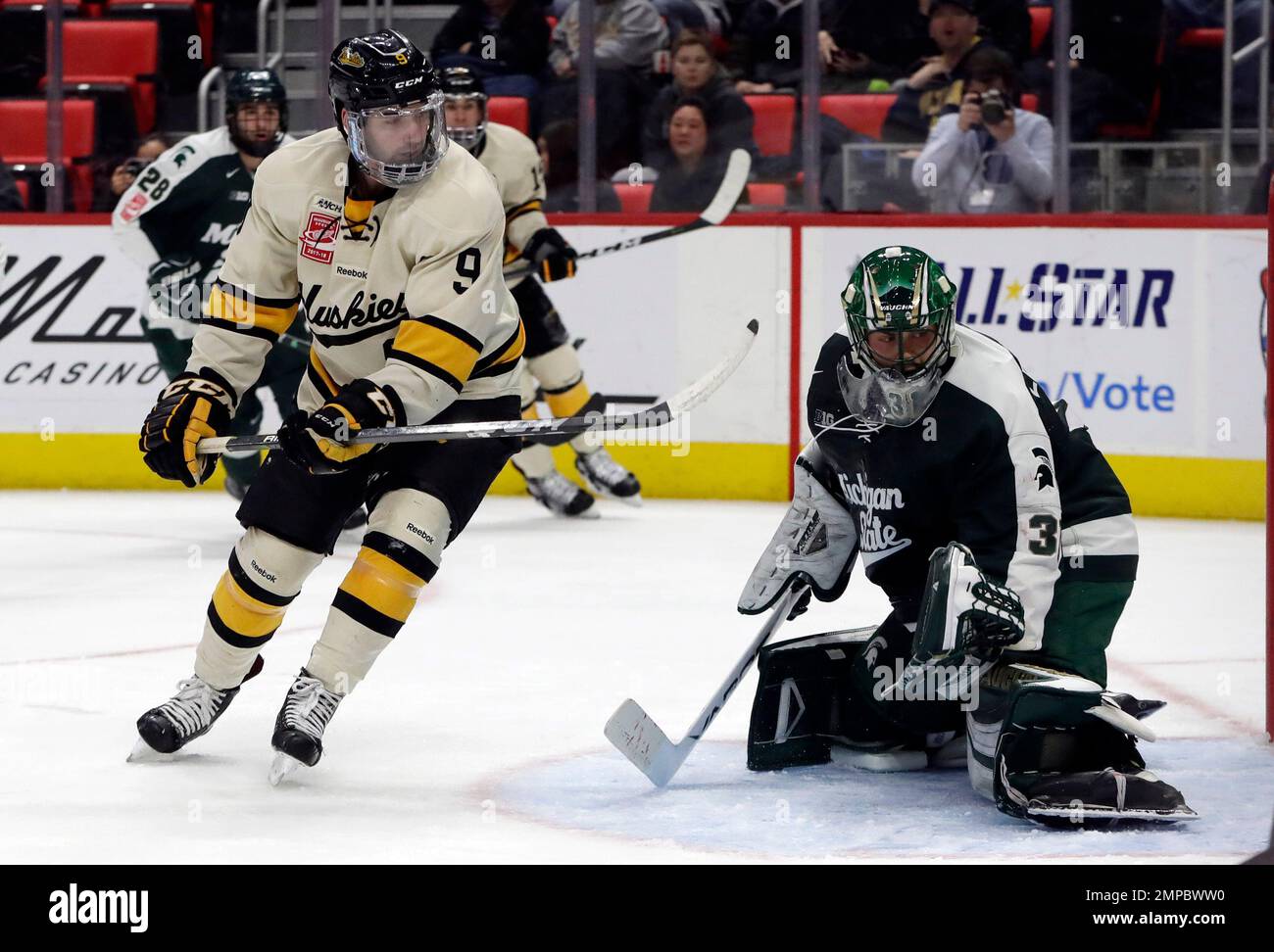 Michigan Tech forward Alex Gillies (9) scores on Michigan State