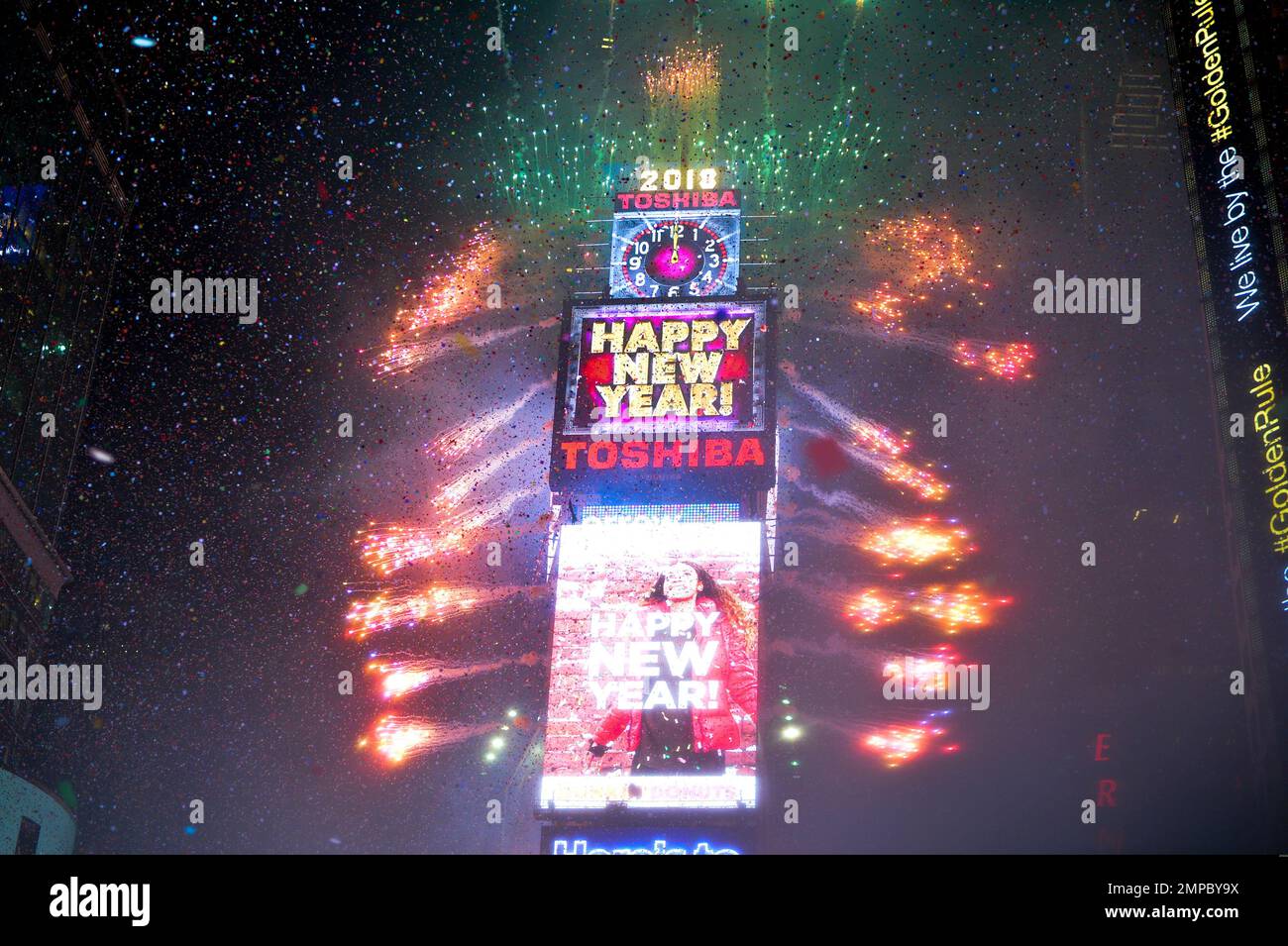 Fireworks erupt as the clock strikes midnight in Times Square during