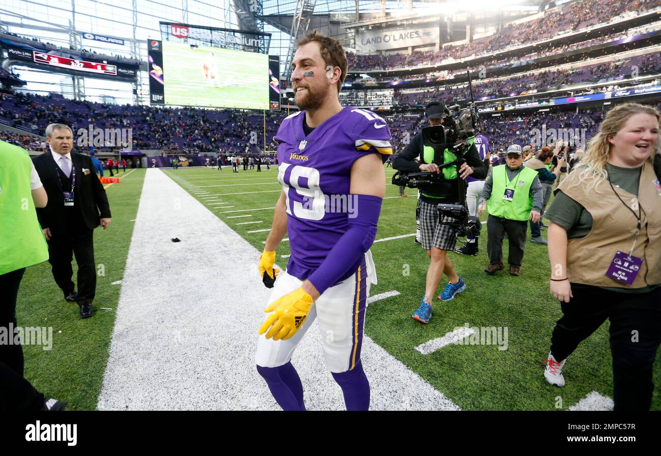 Minnesota Vikings wide receiver Adam Thielen walks off the field after