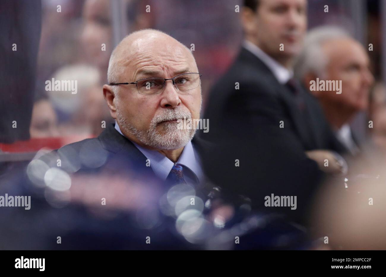 Washington Capitals head coach Barry Trotz stands in the bench during