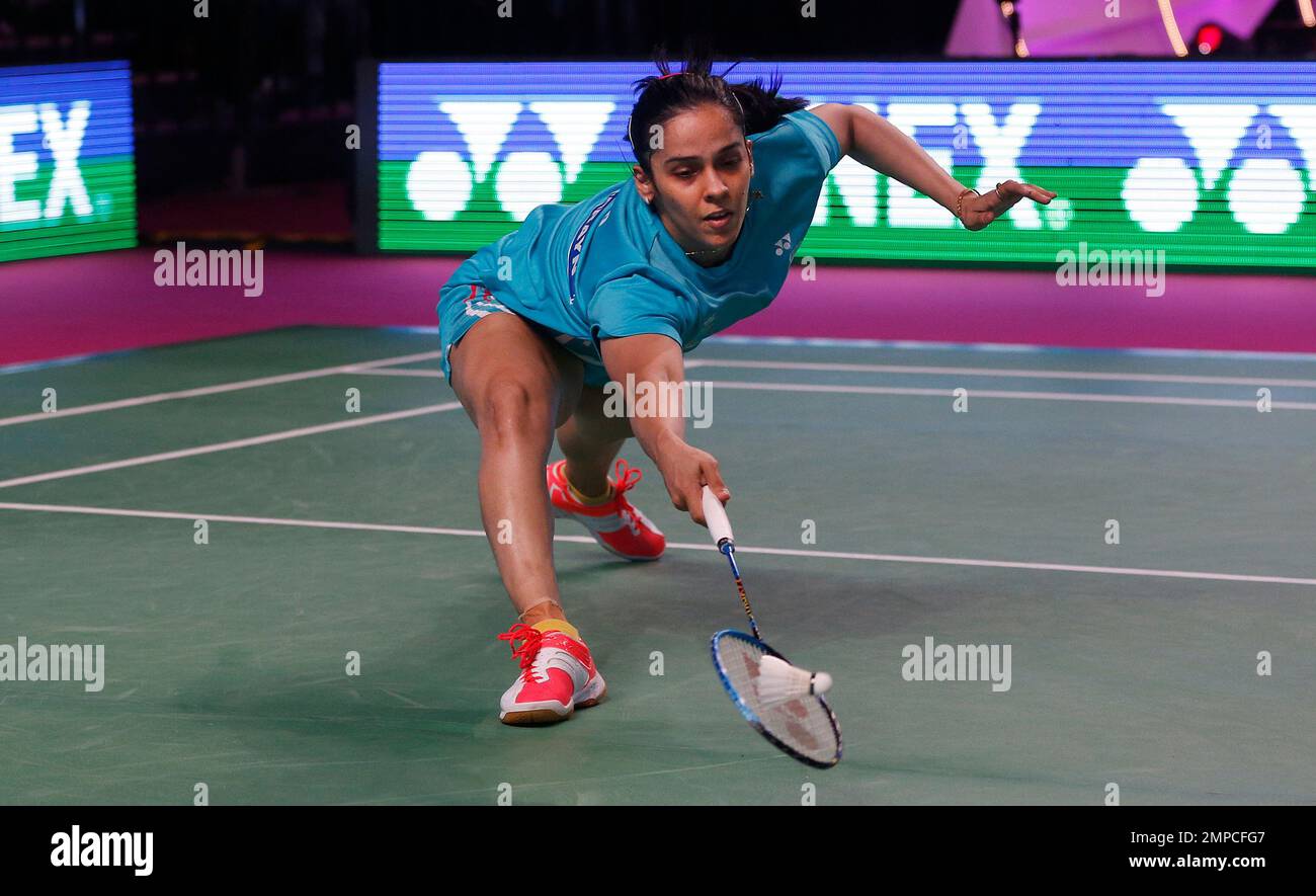 Indian player Saina Nehwal of Awadhe Warriors returns a shot to