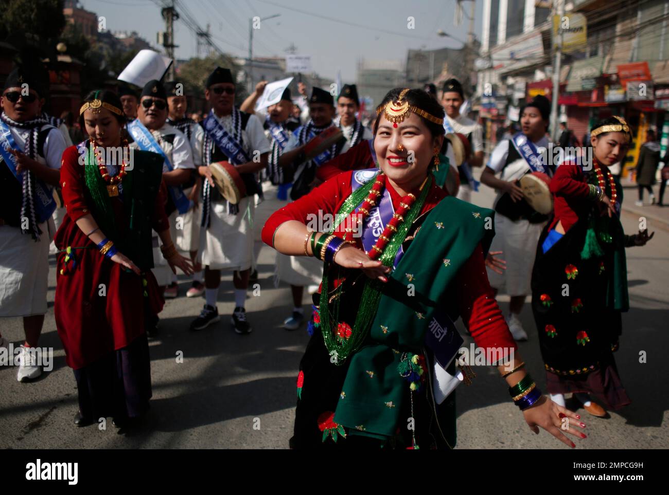 Nepalese Gurung Community Men And Women Wear Traditional Attire As They Dance At A Parade To