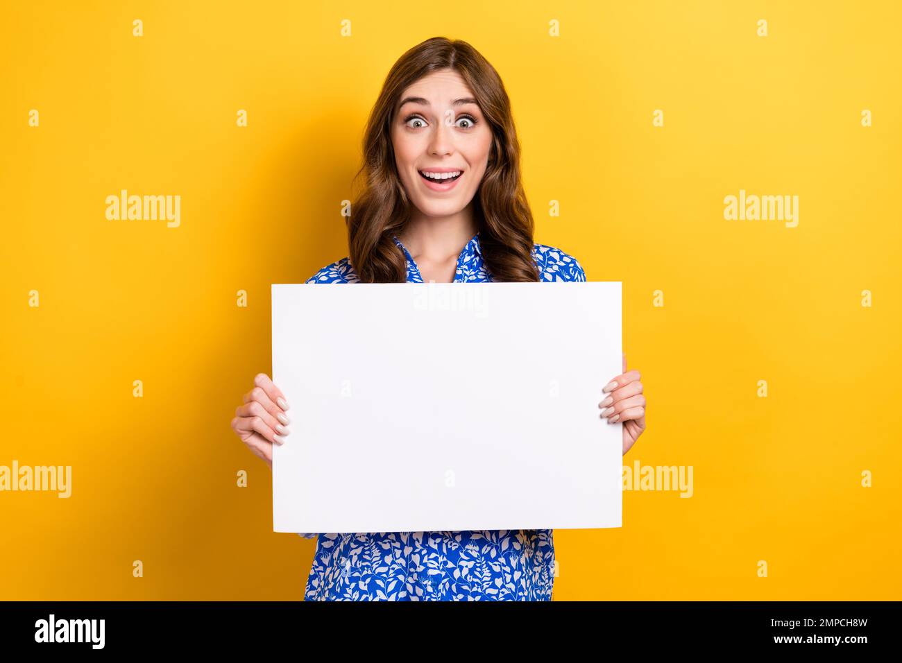 Photo of impressed excited lady wear print shirt showing white billboard empty space isolated yellow color background Stock Photo