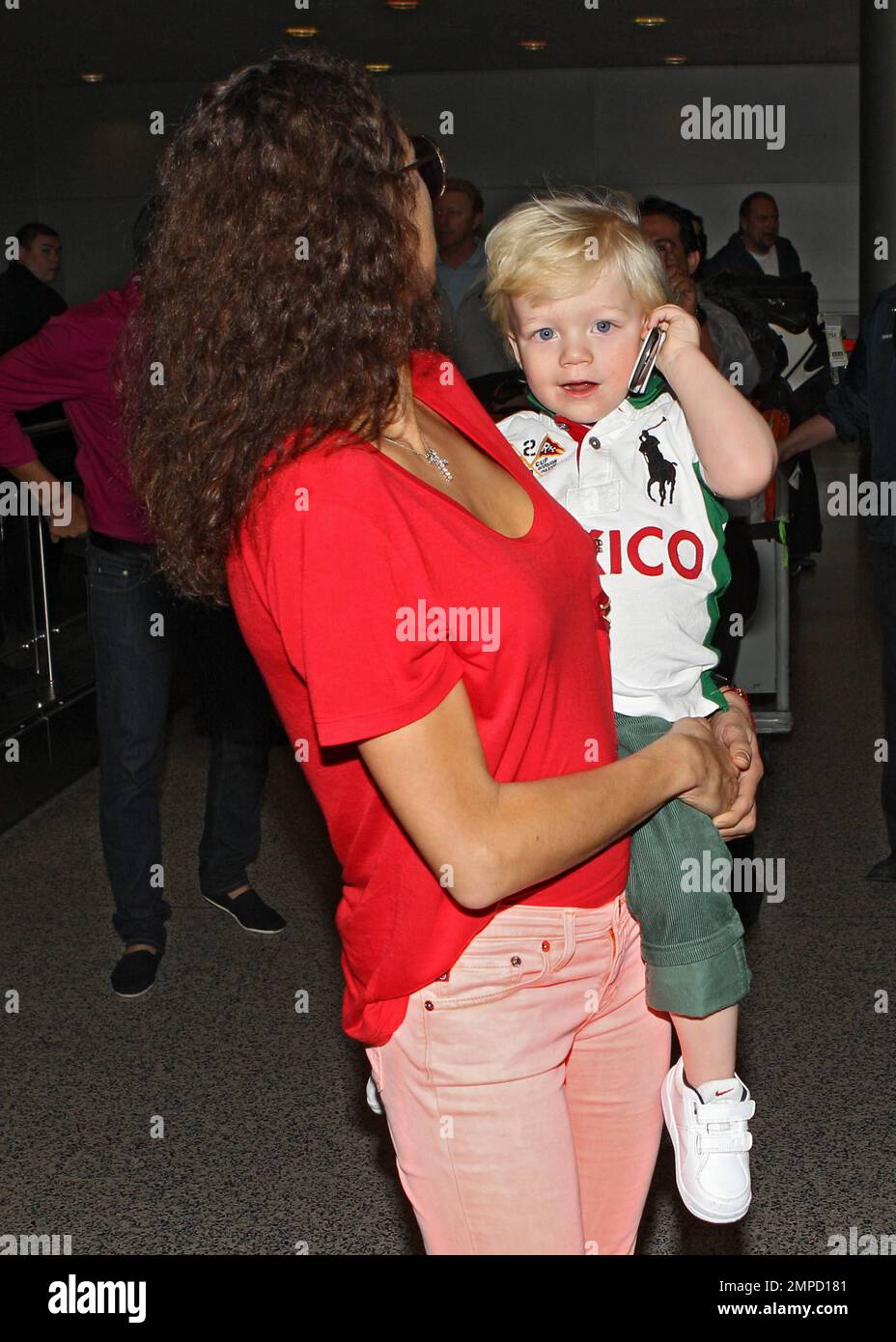 Looking eager to see their family, Boris Becker, wife Sharlely and son Amadeus arrive at Miami International Airport for a holiday visit. Boris' son Noah greeted the trio at the airport and they headed to the car with a luggage cart overflowing with the family's baggage. Boris and Sharlely are in town for a family Christmas with Noah, his other son Elias and ex-wife Barbara. Miami, FL. 19th December 2011. Stock Photo