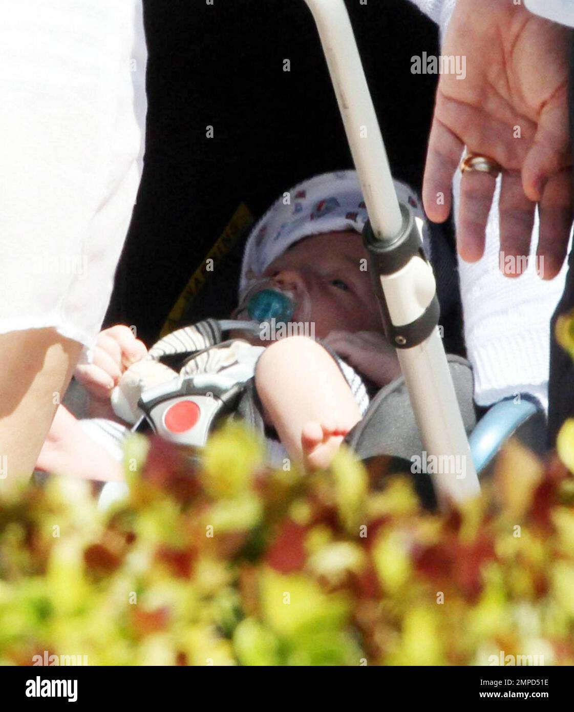 Tennis ace Boris Becker walks along Miami Beach boardwalk yawning and