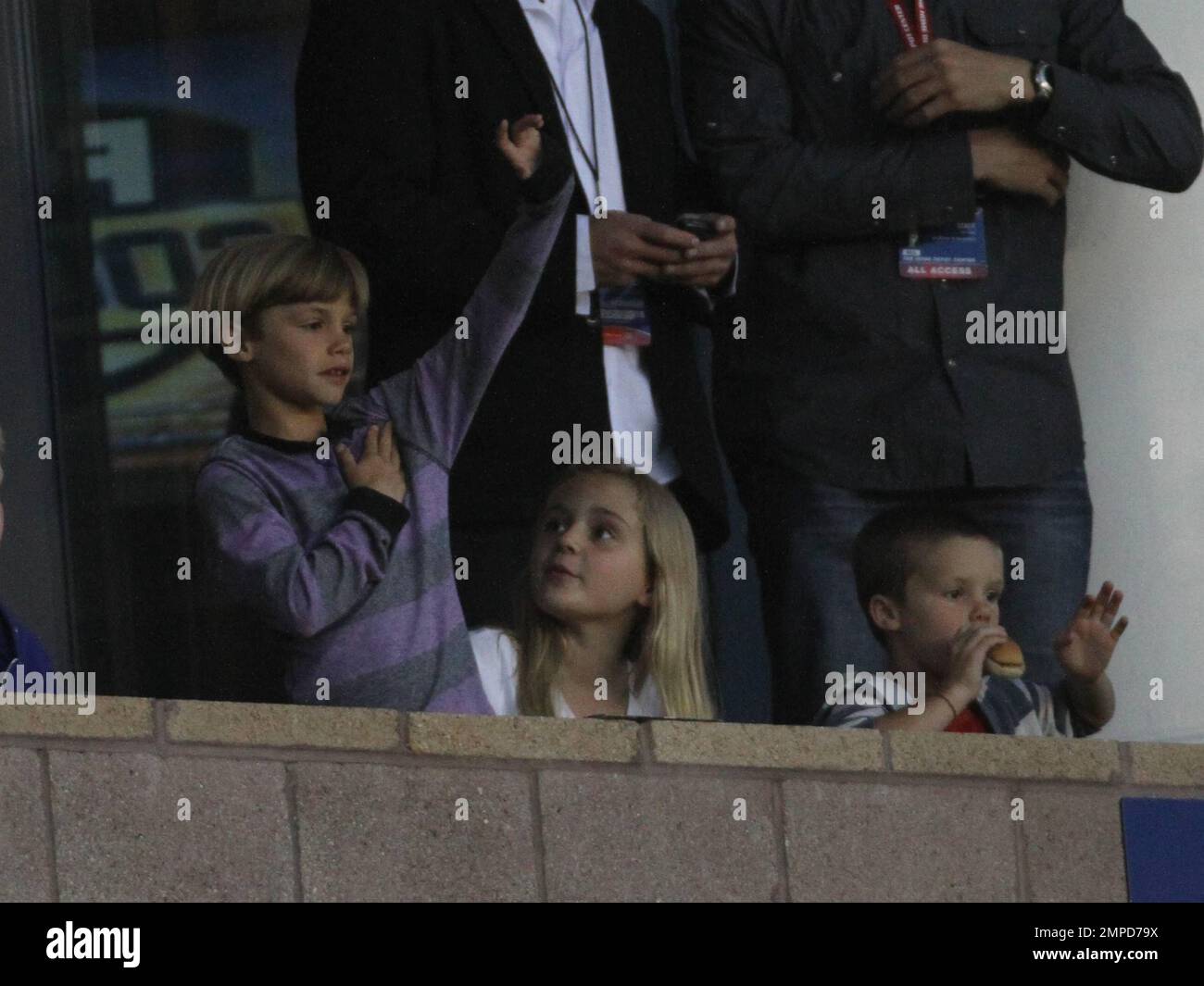 Brooklyn, Romeo and Cruz Beckham watch dad David as he leads the LA Galaxy to a 0-0 tie over the D.C. United. During the game D.C. United midfielder Fred sent Beckham flying with a hard tackle that drew a yellow card in the first half at Home Depot Center. Also  in the box with the boys was Wayne Sneijder and his wife, Dutch actress, Yolanthe Cabau van Kasbergen.  Beckham's pregnant wife Victoria did not appear to be at the game today.  Los Angeles, CA. 06/03/2011. Stock Photo