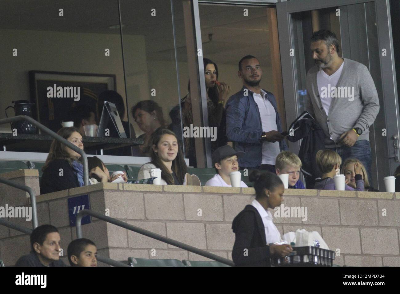 Brooklyn, Romeo and Cruz Beckham watch dad David as he leads the LA Galaxy to a 0-0 tie over the D.C. United. During the game D.C. United midfielder Fred sent Beckham flying with a hard tackle that drew a yellow card in the first half at Home Depot Center. Also  in the box with the boys was Wayne Sneijder and his wife, Dutch actress, Yolanthe Cabau van Kasbergen.  Beckham's pregnant wife Victoria did not appear to be at the game today.  Los Angeles, CA. 06/03/2011. Stock Photo