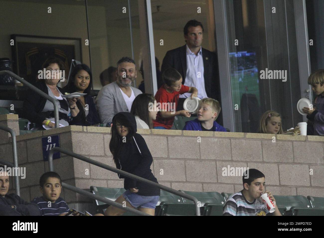 Brooklyn, Romeo and Cruz Beckham watch dad David as he leads the LA Galaxy to a 0-0 tie over the D.C. United. During the game D.C. United midfielder Fred sent Beckham flying with a hard tackle that drew a yellow card in the first half at Home Depot Center. Also  in the box with the boys was Wayne Sneijder and his wife, Dutch actress, Yolanthe Cabau van Kasbergen.  Beckham's pregnant wife Victoria did not appear to be at the game today.  Los Angeles, CA. 06/03/2011. Stock Photo