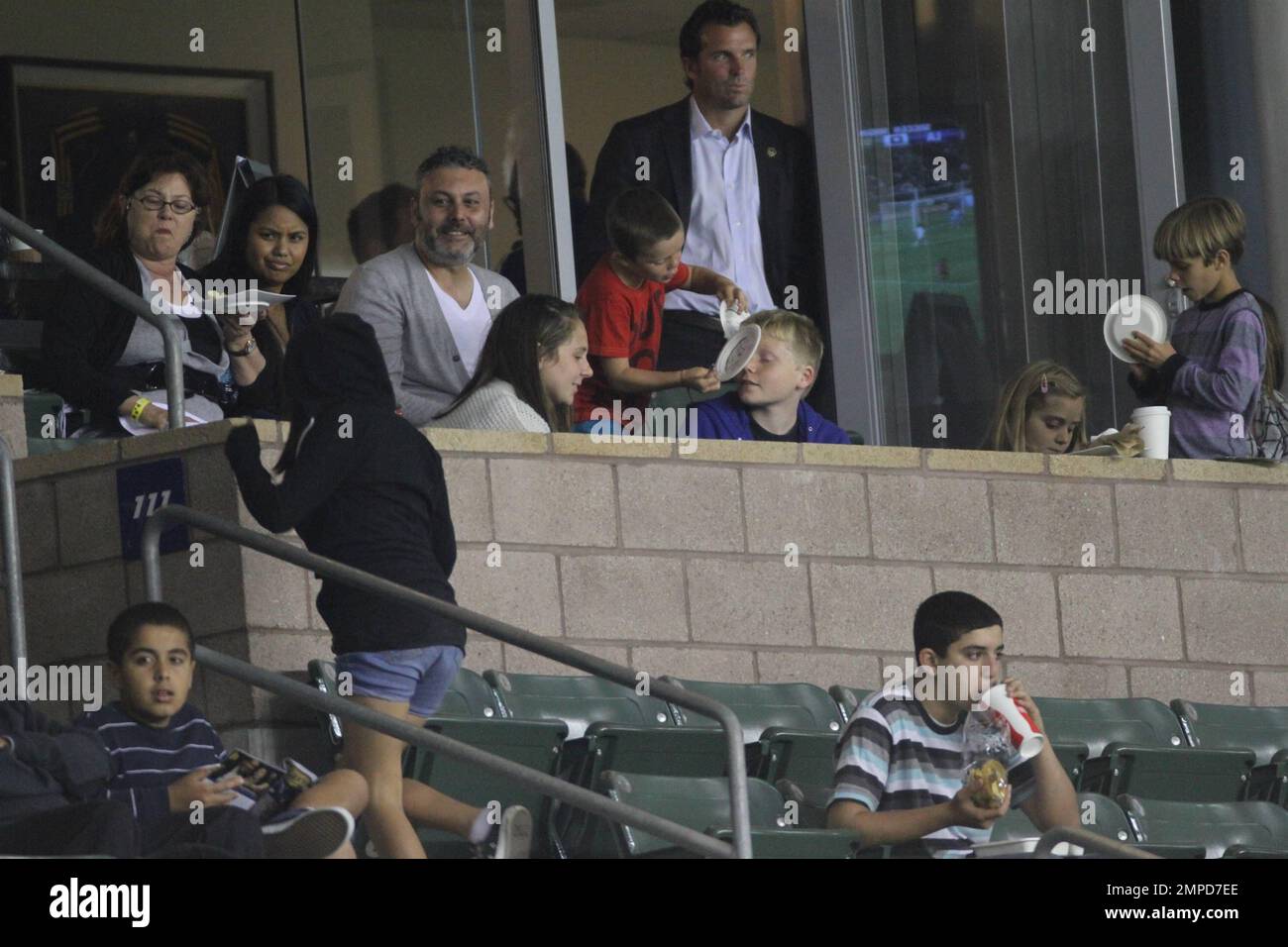 Brooklyn, Romeo and Cruz Beckham watch dad David as he leads the LA Galaxy to a 0-0 tie over the D.C. United. During the game D.C. United midfielder Fred sent Beckham flying with a hard tackle that drew a yellow card in the first half at Home Depot Center. Also  in the box with the boys was Wayne Sneijder and his wife, Dutch actress, Yolanthe Cabau van Kasbergen.  Beckham's pregnant wife Victoria did not appear to be at the game today.  Los Angeles, CA. 06/03/2011. Stock Photo