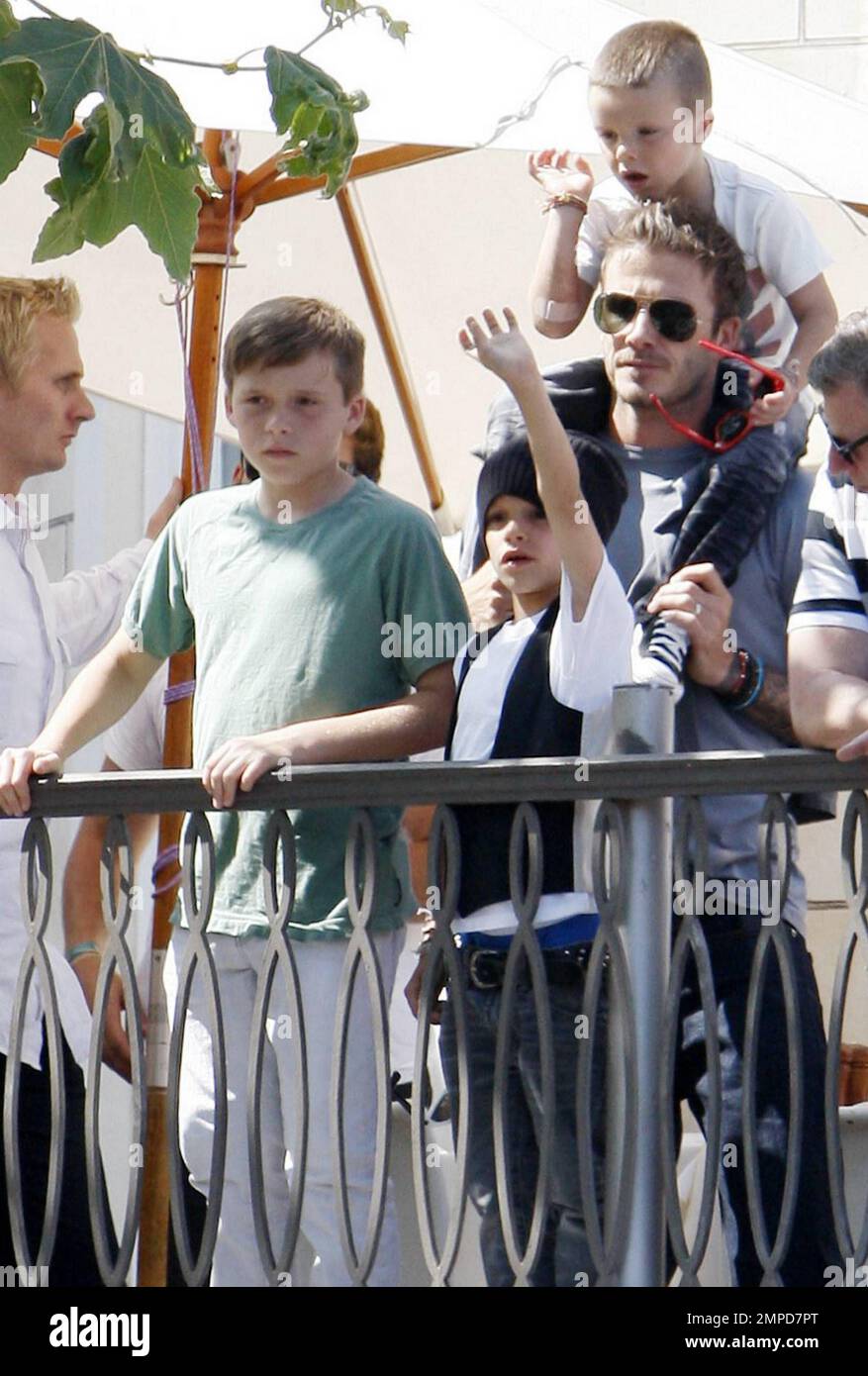 Footballer David Beckham, wife Victoria and their three sons Brooklyn, 11,  Romeo, 8, and Cruz, 5, watch a free Jonas Brothers concert from a balcony  at The Grove open-air shopping center. The