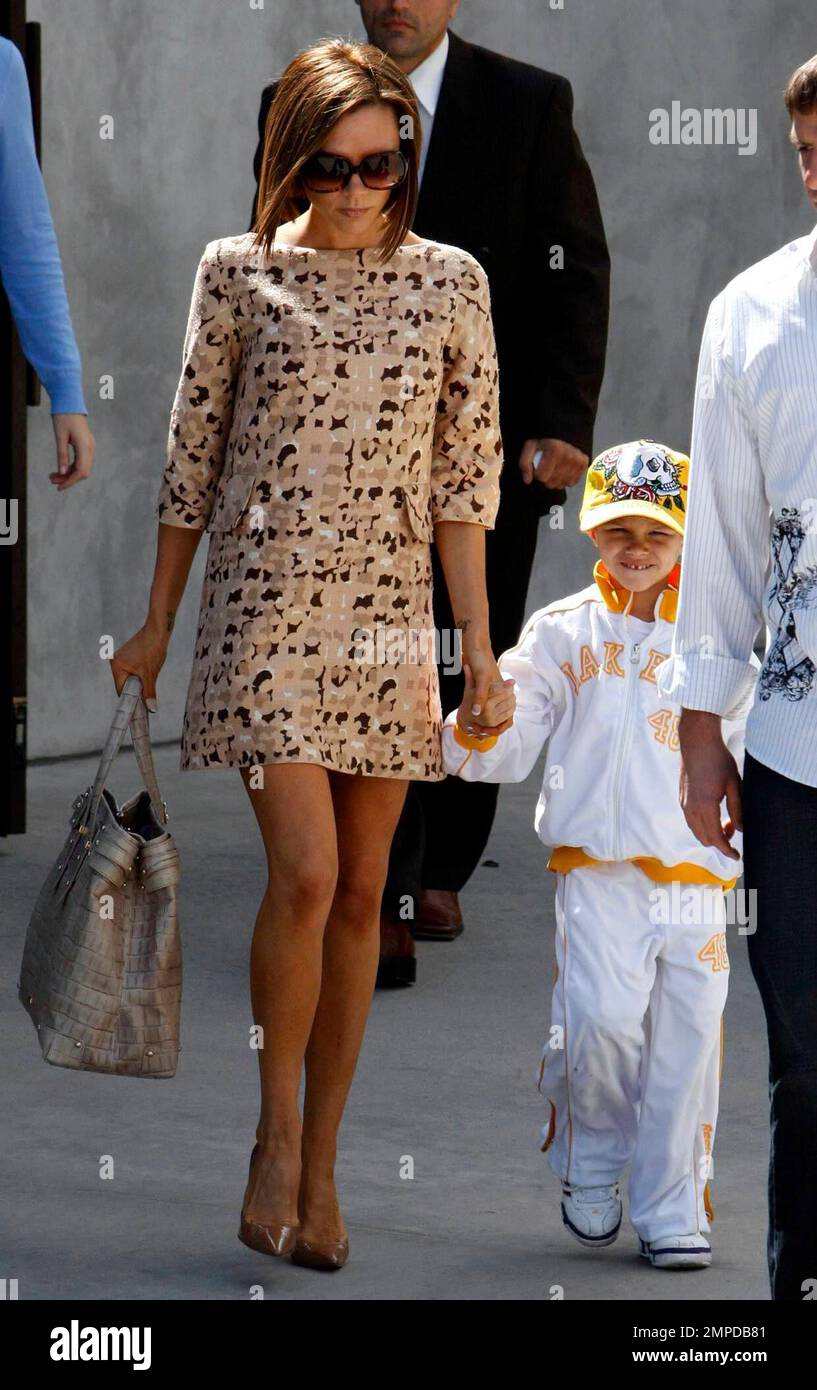 Victoria Beckham takes Romeo for a shopping spree at the Grove and Maxfields. Victoria was wearing a retro style mini dress while her son sported an LA Lakers outfit. Los Angeles Ca