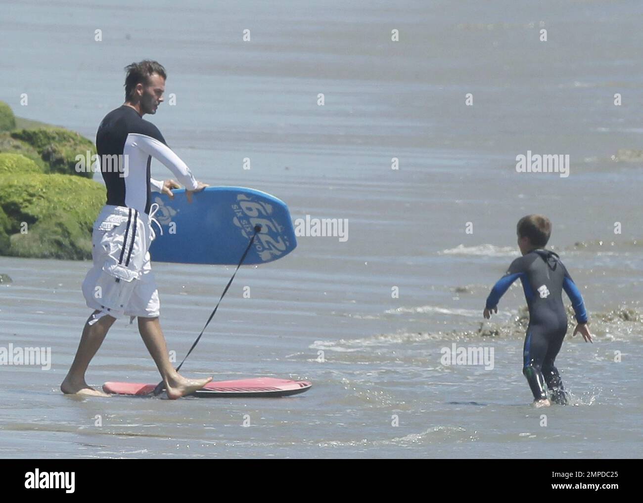 David Beckham and his three sons enjoy another day boogie boarding