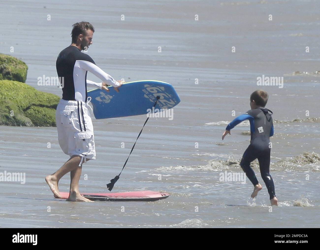 David Beckham and his three sons enjoy another day boogie boarding