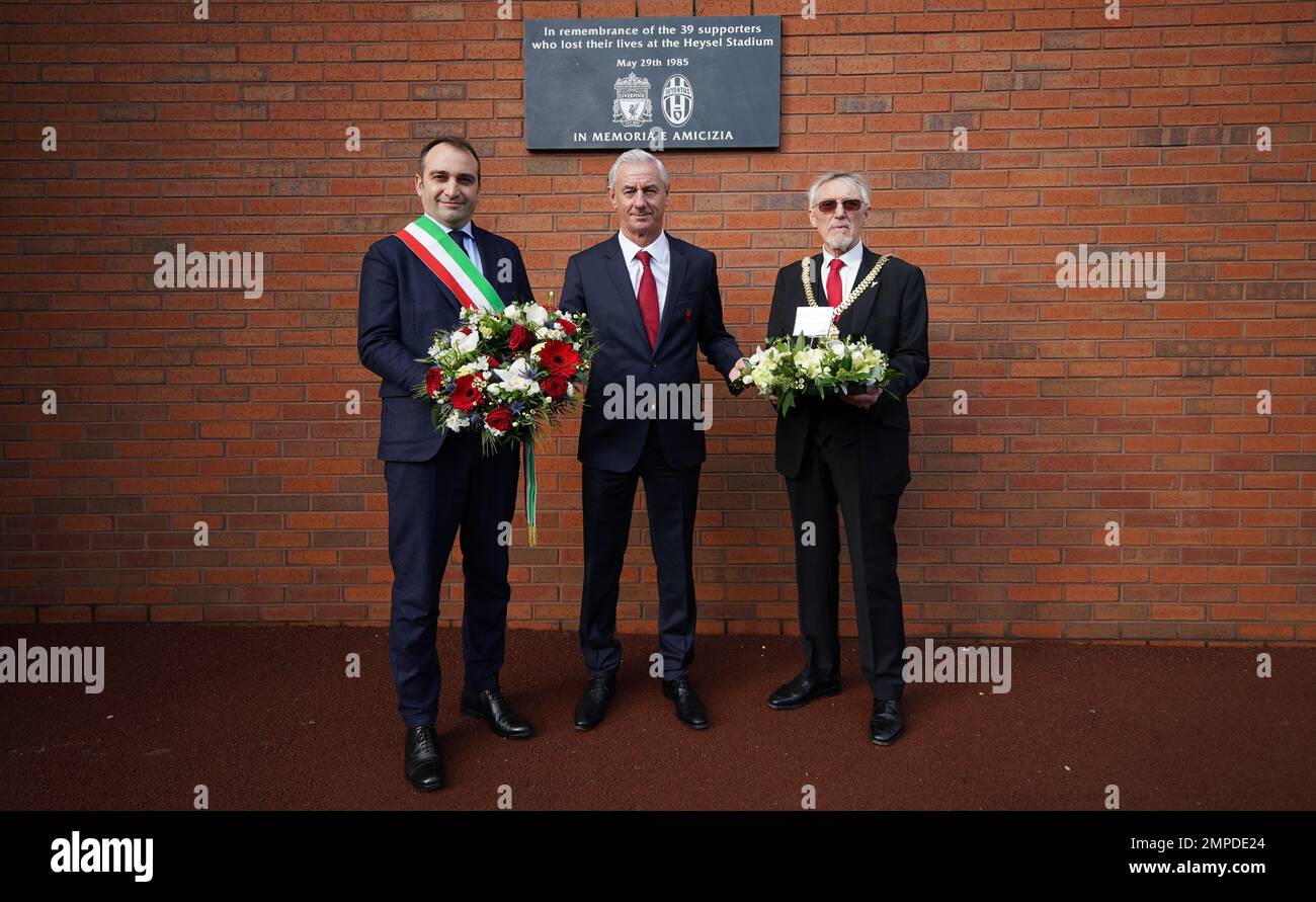 (left to right) Mayor of Turin Stefano Lo Russo, Liverpool FC and former Juventus player Ian Rush and Lord Mayor of Liverpool Cllr Roy Gladden lay a wreath at the Heysel memorial plaque at Liverpool FC's Anfield stadium, in memory of the 39 football fans who lost their lives in the 1985 Heysel Stadium disaster. Picture date: Tuesday January 31, 2023. Stock Photo