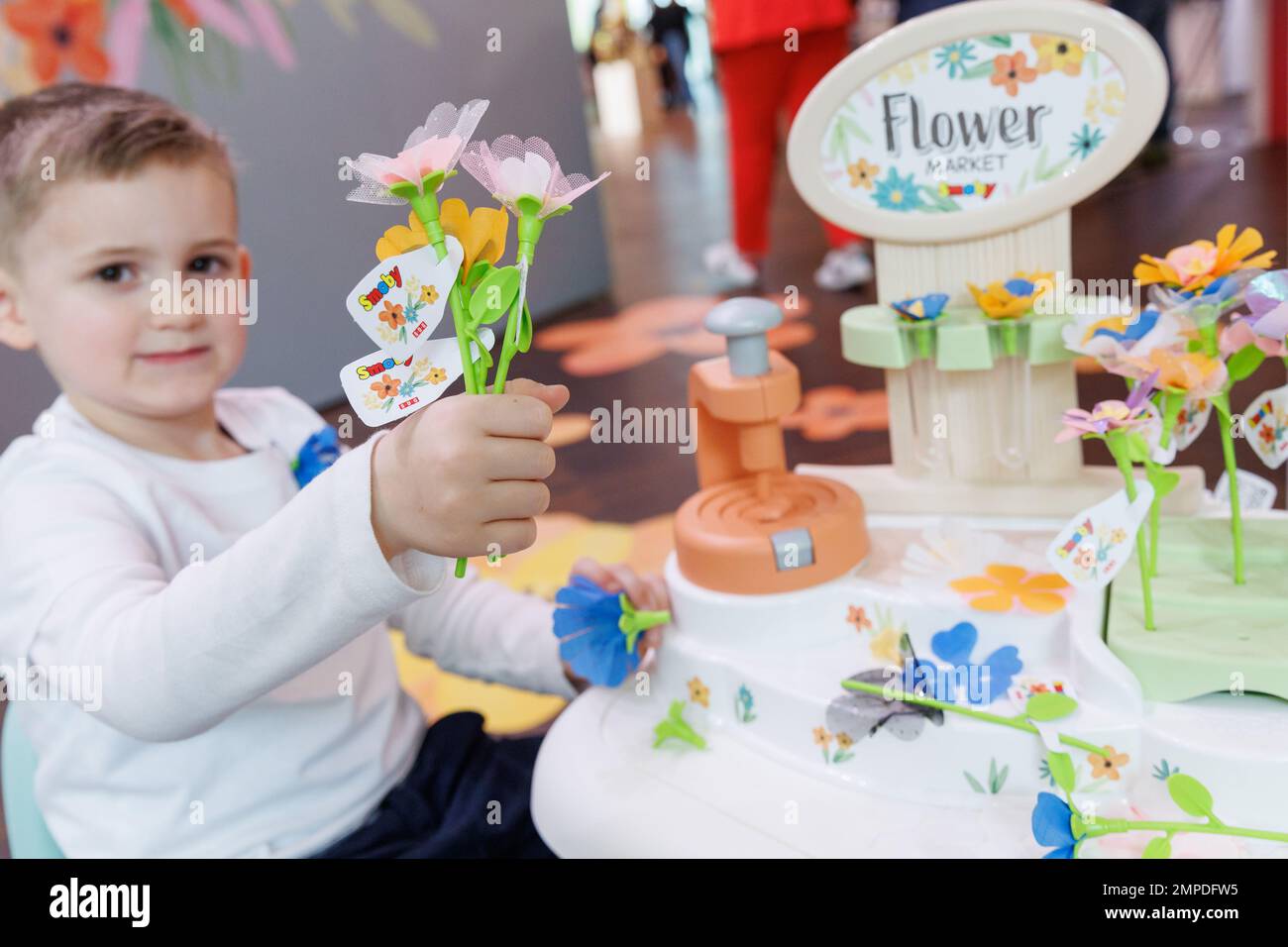Nuremberg, Germany. 31st Jan, 2023. Nick plays with Flower Market from Smoby  Toys during the Toy Fair novelty show. The toy allows children to create  their own flowers. The 72nd Spielwarenmesse runs