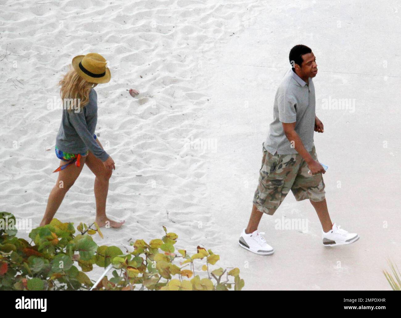 EXCLUSIVE!! Beyonce takes a stroll on the beach and paddles in the ocean during a quick visit to