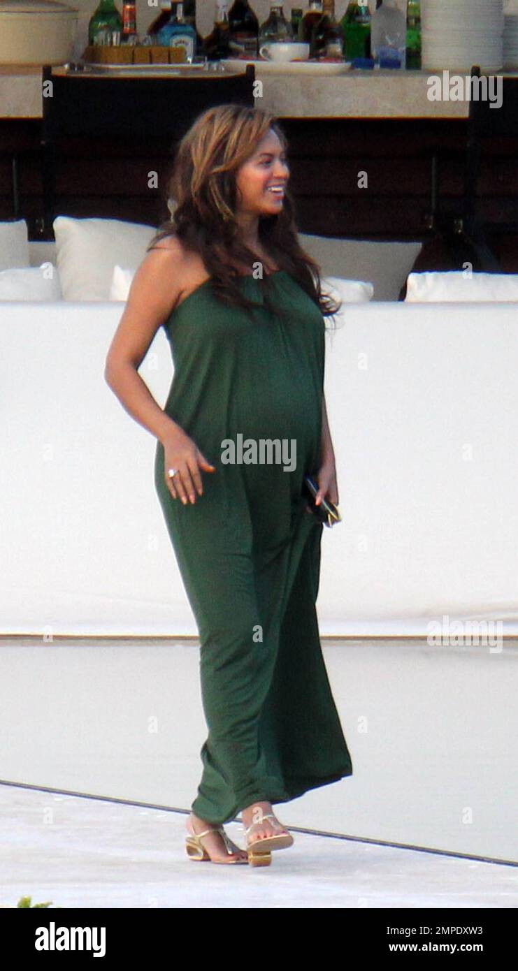 beyonce pregnant green dress Beyonce Knowles looks positively glowing in a long green maxi dress that shows off her growing baby bump whilst visiting A Rod's new Miami home with husband Jay Z and their entourage