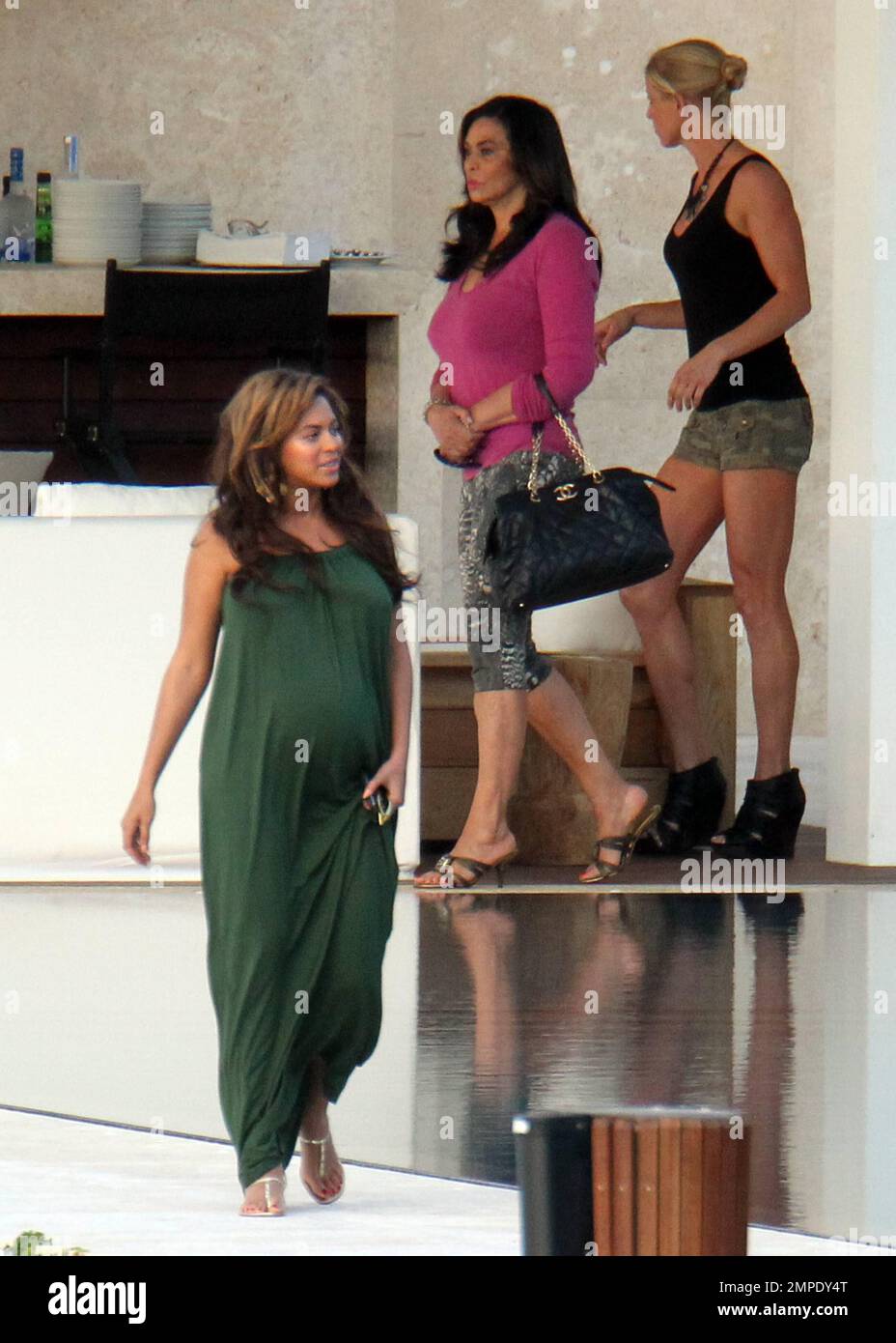 beyonce green dress pregnant Beyonce hits up TIDAL X concert in glamorous green gown