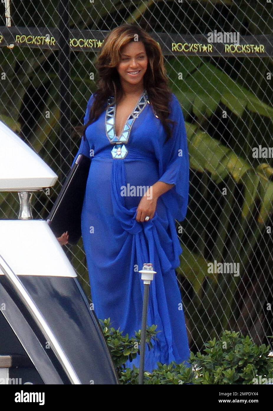 EXCLUSIVE!! Pregnant blooming beauty, Beyonce, spends an afternoon aboard a  luxury yacht with her family. Queen Bee wore a sheer royal blue dress over  a matching blue bikini which revealed her growing