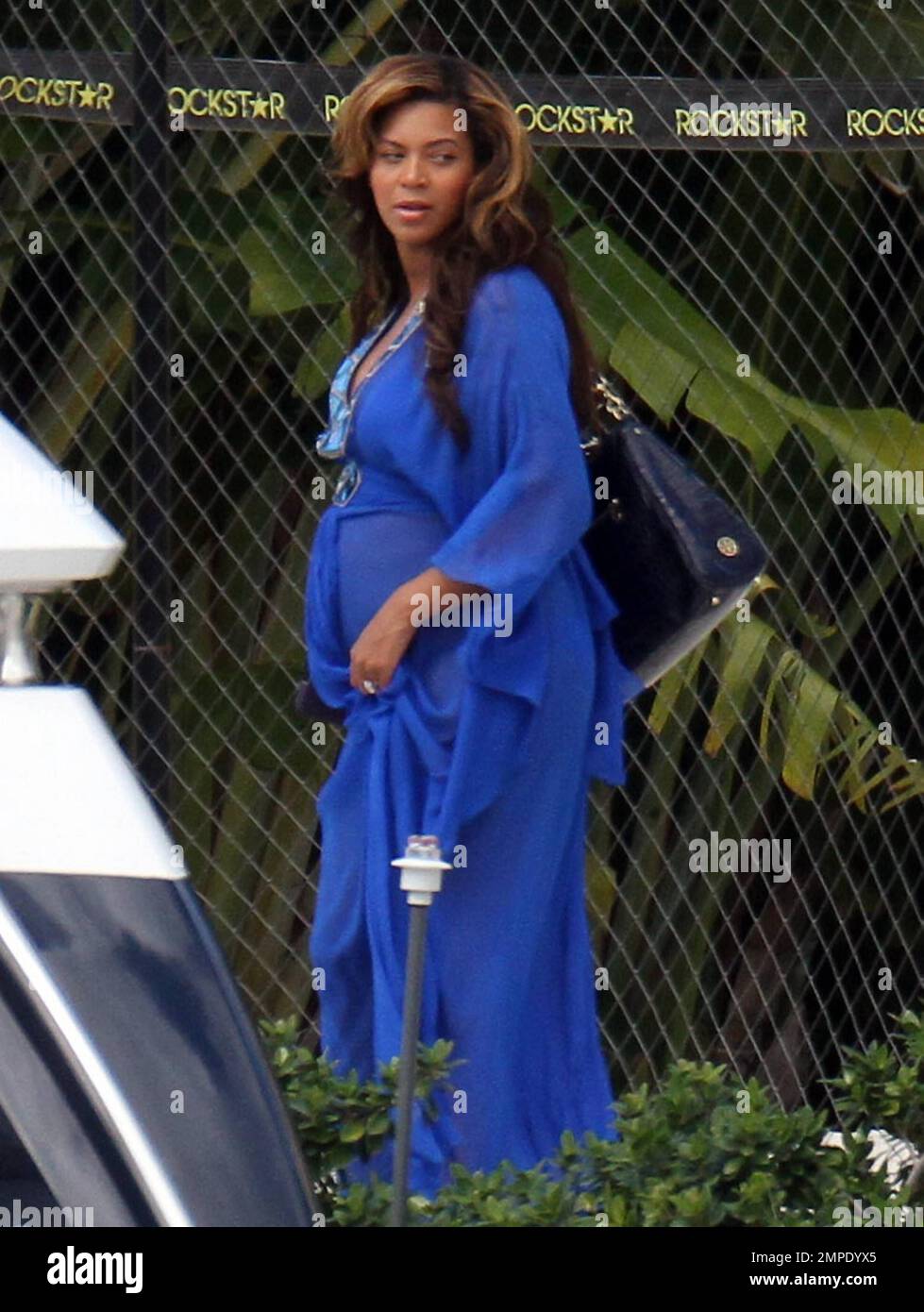 EXCLUSIVE!! Pregnant blooming beauty, Beyonce, spends an afternoon aboard a  luxury yacht with her family. Queen Bee wore a sheer royal blue dress over  a matching blue bikini which revealed her growing