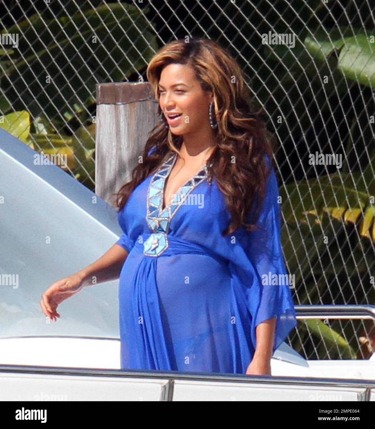 Pregnant blooming beauty, Beyonce, spends an afternoon aboard a luxury  yacht with her family. Queen Bee wore a sheer royal blue dress over a  matching blue bikini which revealed her growing bump.