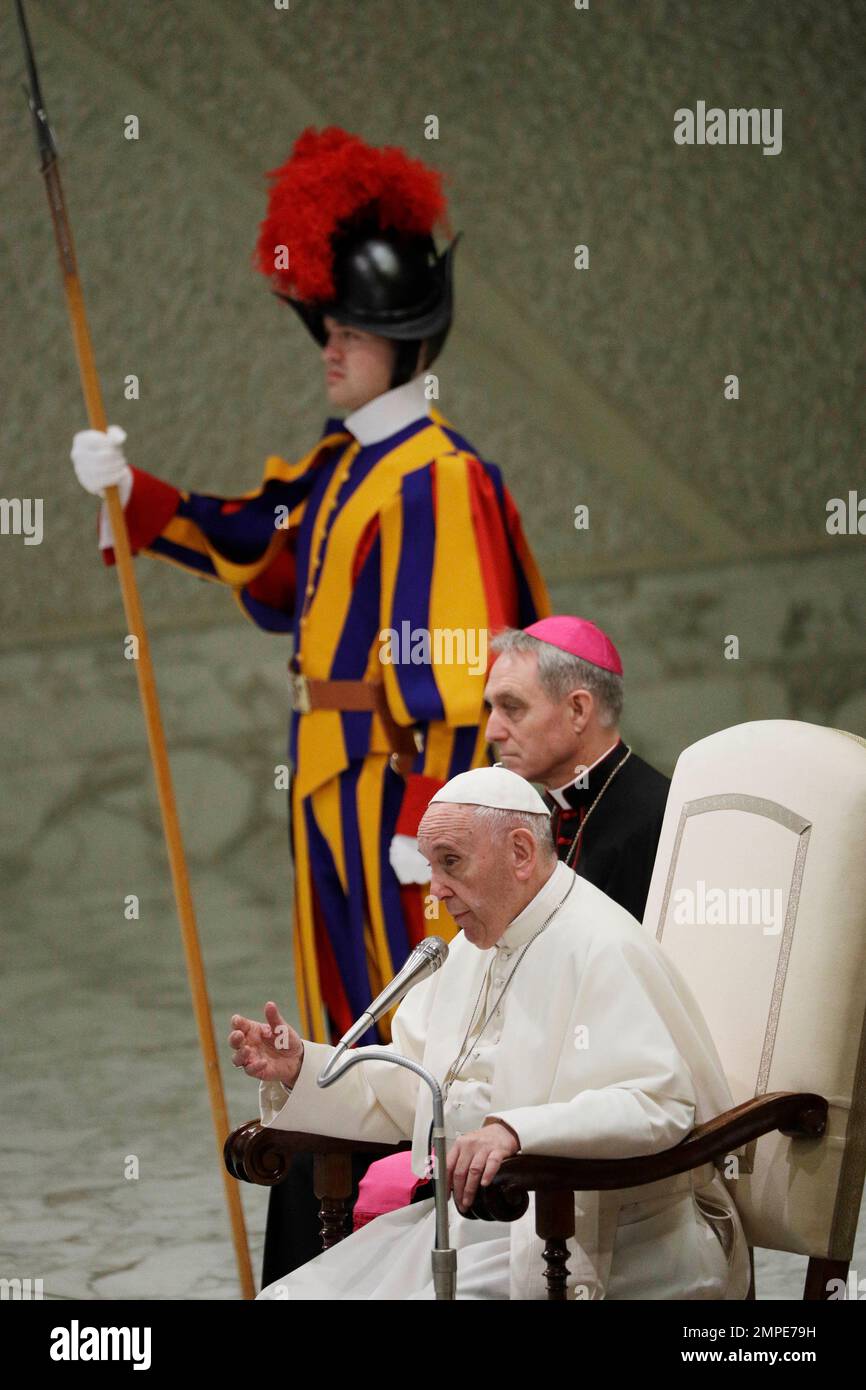 Pope Francis speaks during an audience to exchange Christmas greetings