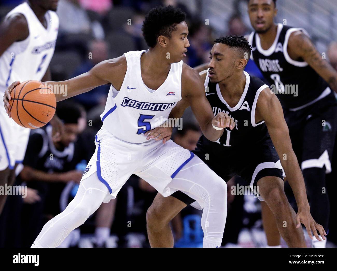 Creighton's Ty-Shon Alexander (5) is defended by USC Upstate's Deion ...