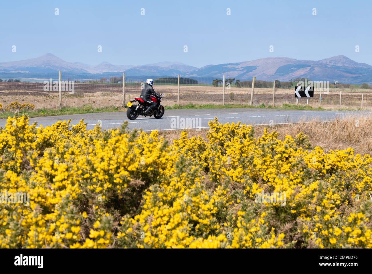 motorcyclist on the B822 Crow Road between Fintry and Kippen, Stirling, Scotland, UK Stock Photo