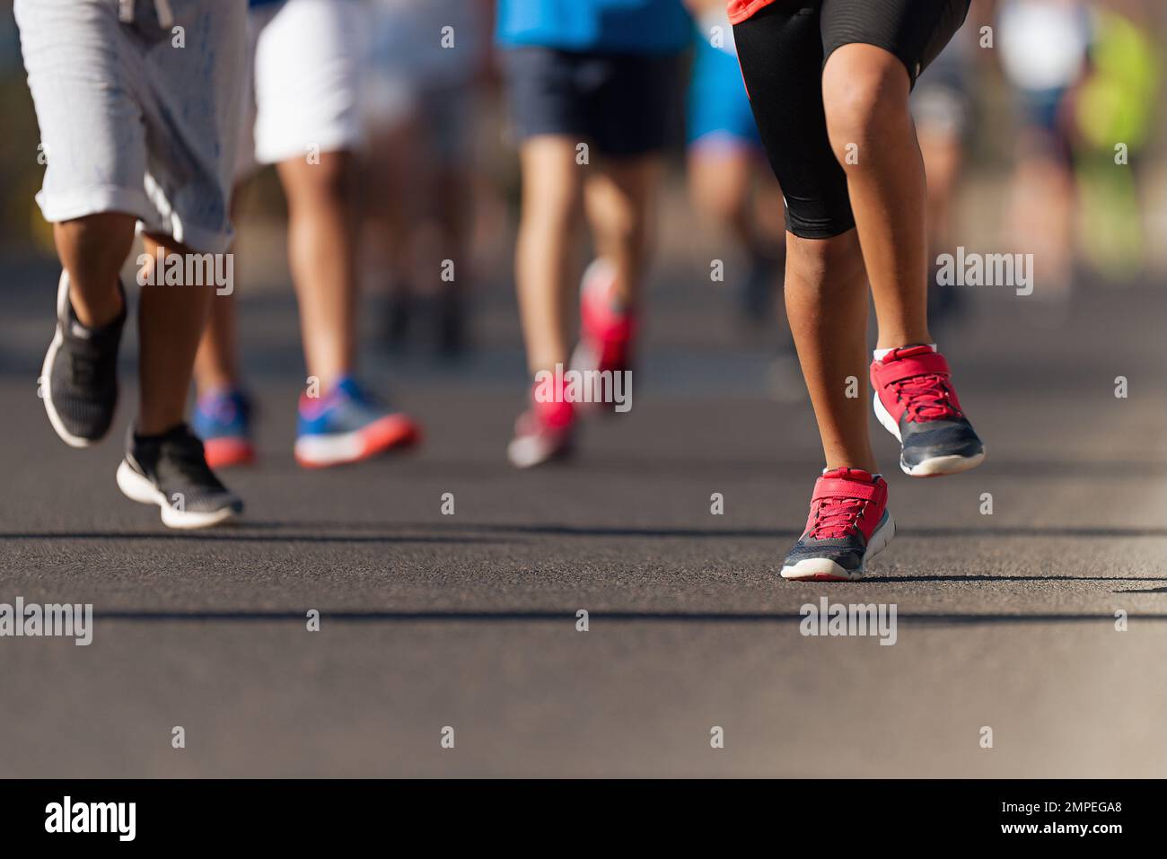 Running children, young athletes run in a kids run race,running on city