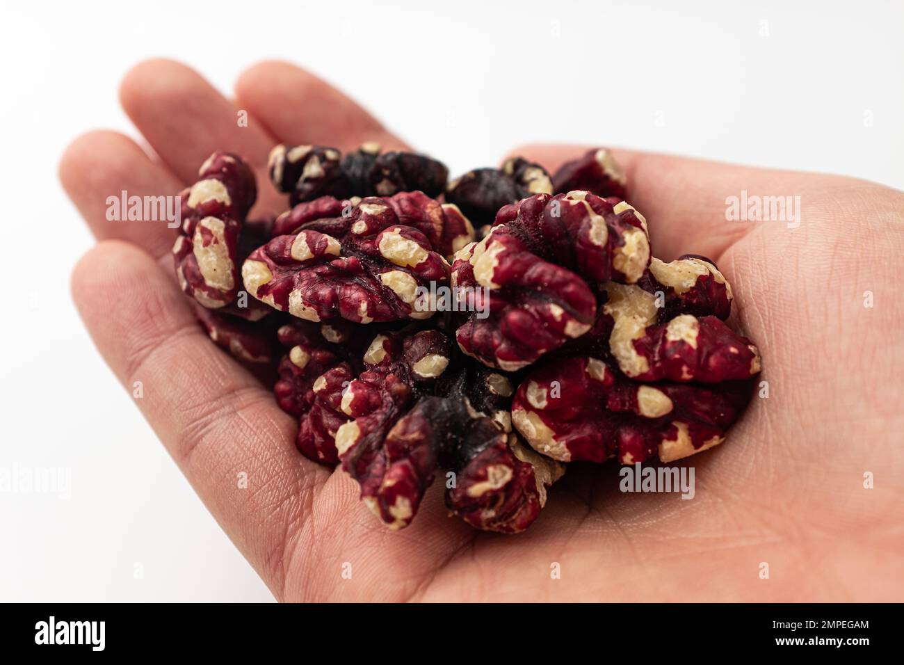 Red walnuts on a white background Stock Photo