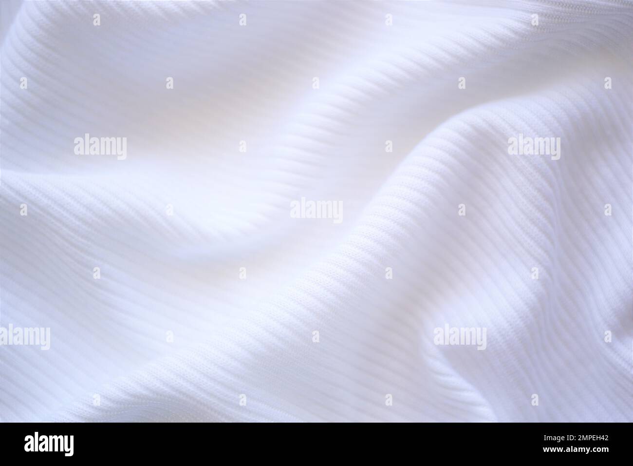 wrinkled white jersey, soft fabric background. Stock Photo