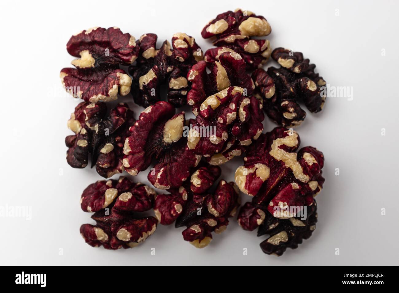Red walnuts on a white background Stock Photo