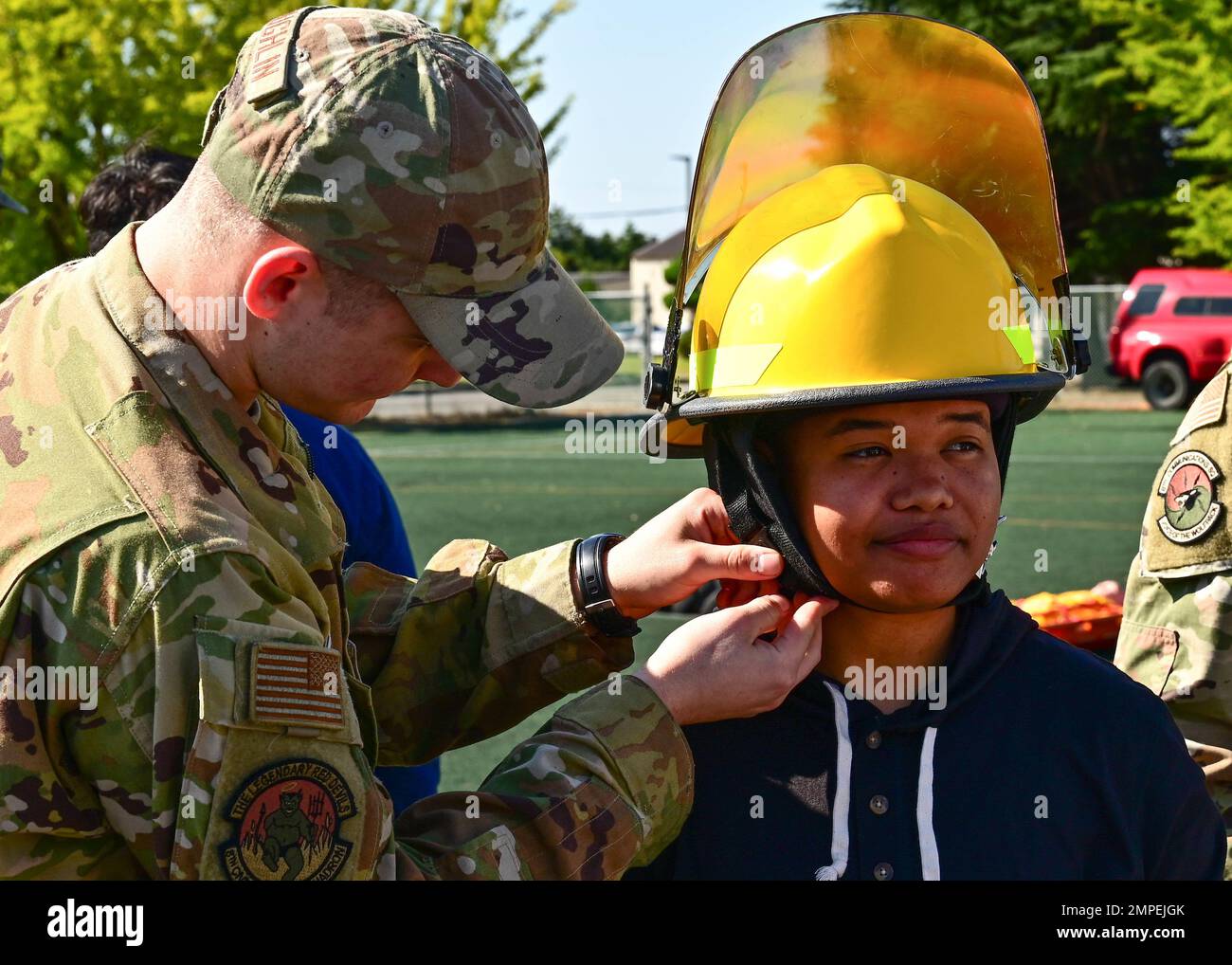 Airman Jacob Mclaughlin, 8th Civil Engineer Squadron firefighter, left